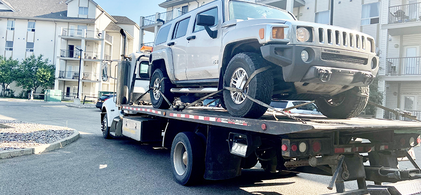Safe And Secure: How Flatbed Towing Ensures Damage-Free Vehicle Transport
